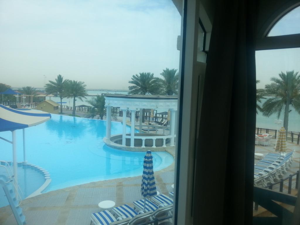 Tio Sea Resort Ал Хор Екстериор снимка View of the pool at the Al Khobar Hilton